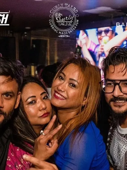 A fun group photo, capturing the friendly and energetic vibe of the night.