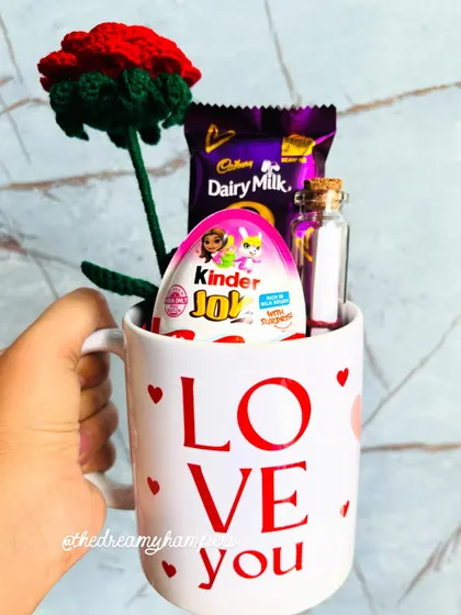 I put together this cozy and affordable Valentine's mug hamper to spread a little love. It includes a 'Love You' mug, a handmade crochet rose, chocolates, and a tiny message in a bottle.