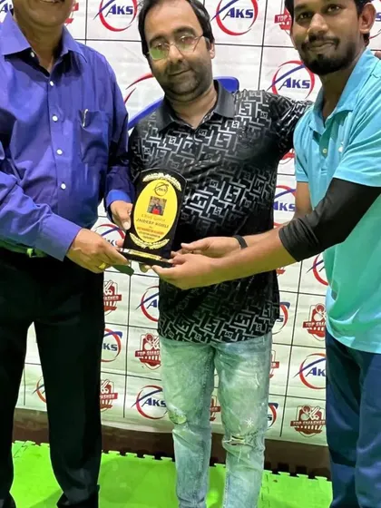 Presenting a plaque to a tournament sponsor. Community support is vital for creating opportunities for my players.