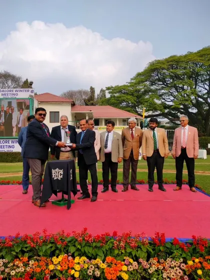 The Maj. C. Newton-Davis Memorial Trophy Div I is presented to the winning connections of Del Aviz.