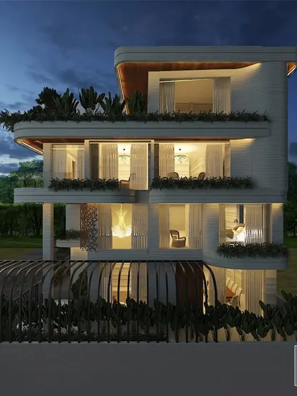 A dusk view of our Gujarat bungalow design, where the architectural lighting highlights the structure's elegant curves and textures. This render demonstrates how we plan for a building's 24-hour aesthetic appeal.