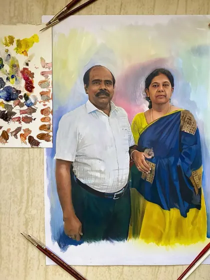 The finished oil painting of the Nagercoil couple, shown next to my color palette. You can see how I mix the skin tones and background colors.