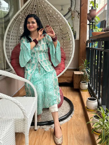 Trying to get a good shot of my Teej mehndi! It’s these small traditions, like applying mehndi and wearing bangles, that make festivals so special. This comfortable printed kurta is perfect for enjoying the day.