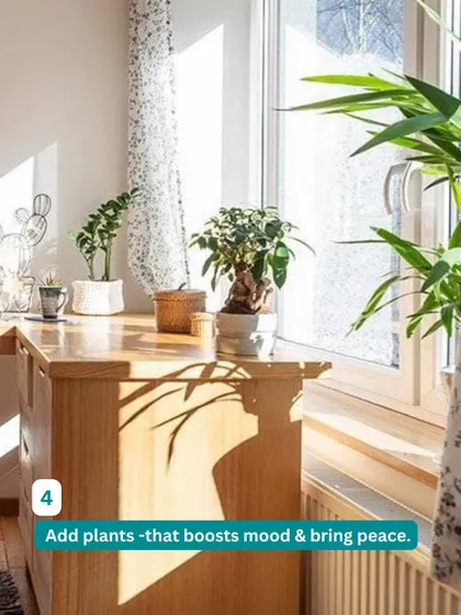 Adding plants to your workspace can boost your mood and bring a sense of peace. This wooden desk is placed by a window to take advantage of natural light and a green view.