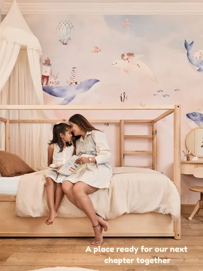 A quiet moment with my daughter in her newly designed room. Creating a special space for her before the baby's arrival was our way of making her feel secure and loved.