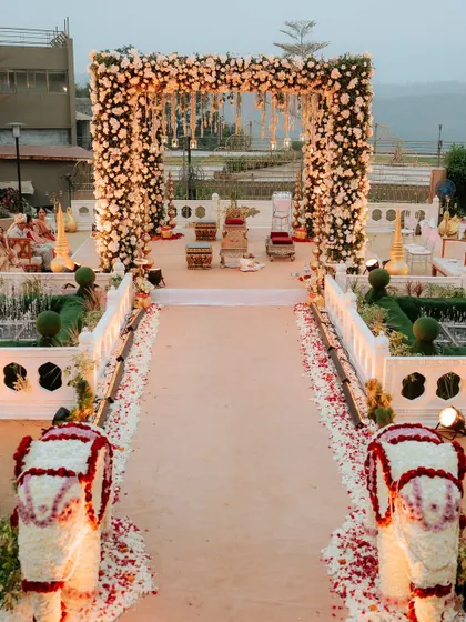 This is the kind of breathtaking entrance I love to create. For this Khandala wedding, I designed a grand floral archway and aisle, lined with custom elephant statues made of flowers, to give the couple a truly royal welcome to their ceremony.