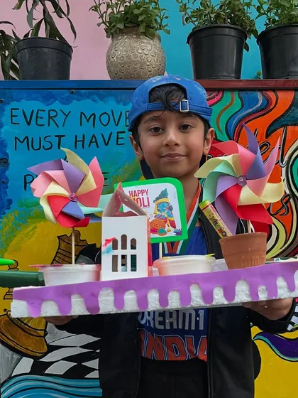 This student created a unique Holi platter featuring a small handmade house.