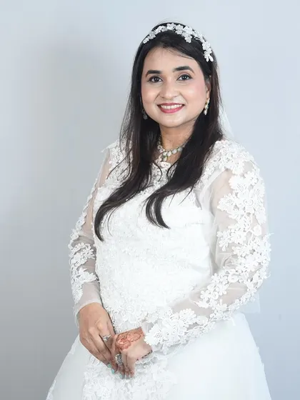 A beautiful portrait of a client in a long-sleeved lace wedding gown. So elegant and timeless.