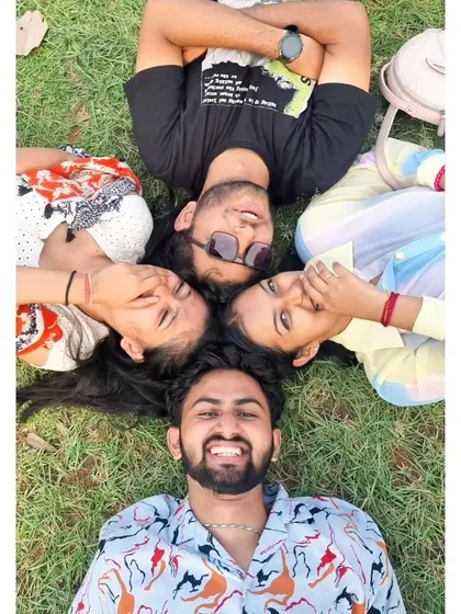 A duplicate of a fun, creative group photo on the grass. We always find time for some playful moments and cool pictures.