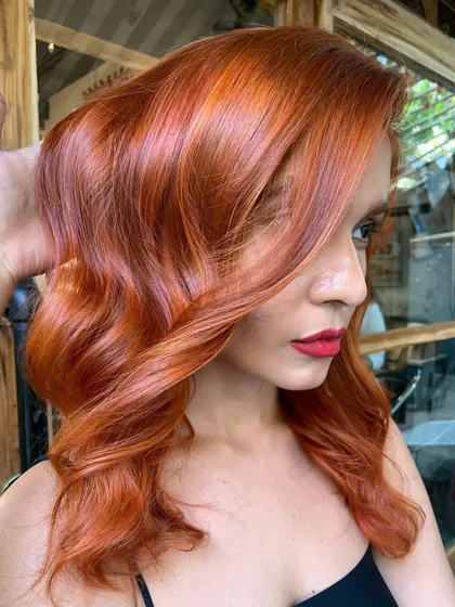A beautiful client rocking her new auburn hair. The color is so flattering and bold. (No filter)