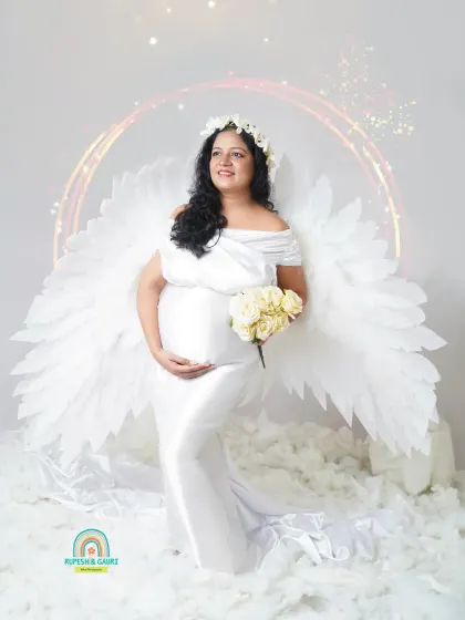 For the mom-to-be who wants something truly unique, we created this "Angel Wings" concept. This themed studio setup turns your maternity portrait into a piece of art, celebrating the angelic feeling of creating life.