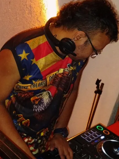 A close-up of me listening to the cue in my headphones, ensuring a smooth transition between songs.