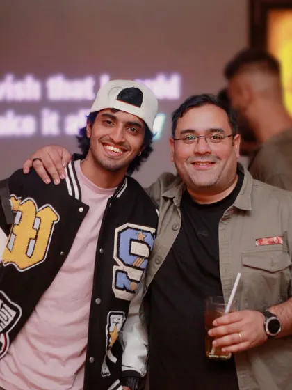 Two friends enjoying the Sunday night karaoke vibe at Watson's in Vasanthnagar.