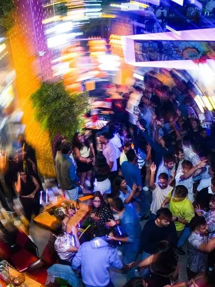 This is the 'Party Ninja' effect. An overhead shot capturing the whirlwind of energy on the dance floor. My job is to get everyone lost in the music.