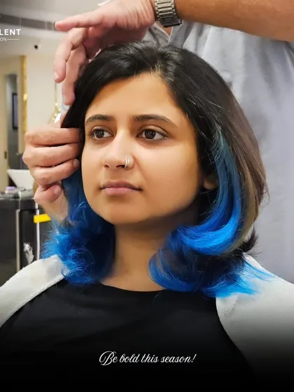 Be bold this season with a pop of electric blue. I added these vibrant blue peekaboo highlights to give her bob an edgy and unexpected twist.