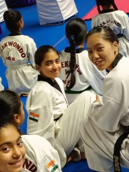 Our taekwondo students take a break during the 3rd International Taekwondo Championship. Competing in an event with participants from six countries is a fantastic opportunity for growth and exposure.