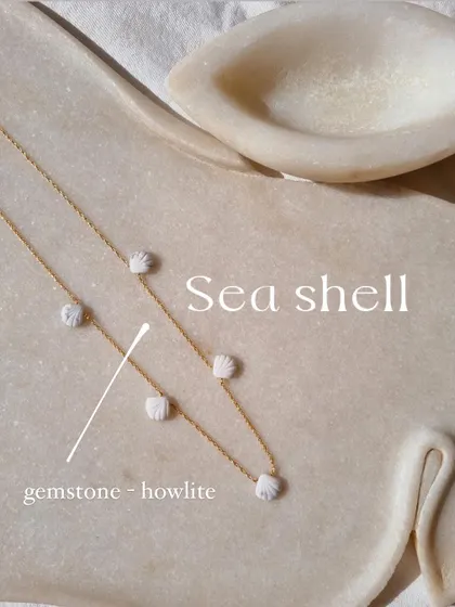 My beach shell collection includes this Howlite choker, a stone for patience and calm.