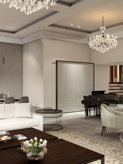 For this multi-generational farmhouse in New Delhi, we created an open-plan living area that feels both grand and connected. Classic elements like crystal chandeliers and recessed ceilings are blended with modern furniture to create a timeless aesthetic.