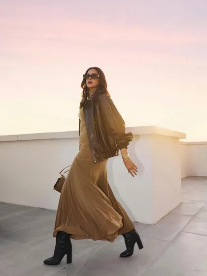 Deepika Padukone in motion. Her hair flows beautifully, demonstrating how a great cut and style can look stunning from every angle, even in a candid moment.