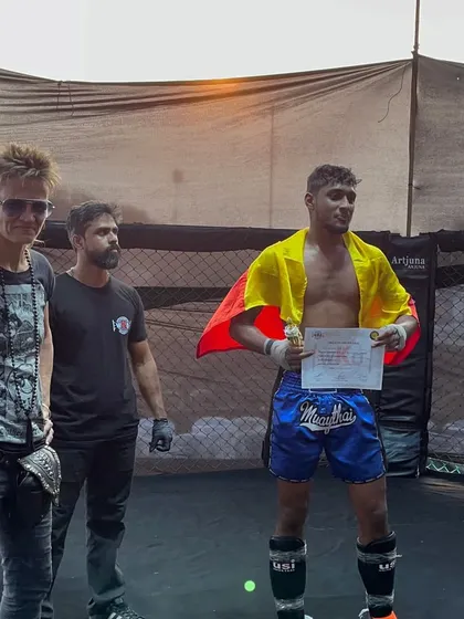 One of our younger fighters, Bhushan, draped in the Karnataka flag after a tough win against an older opponent. This shows the heart and courage we nurture.