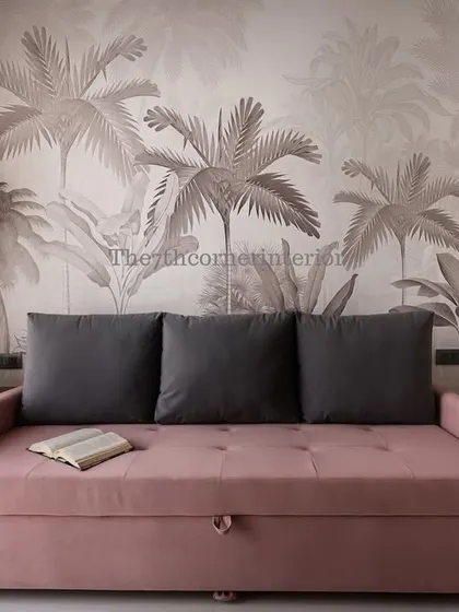 For this guest bedroom, I used a custom sofa-cum-bed to maximize space. The tropical-themed wallpaper adds a cheerful and welcoming vibe, making guests feel right at home.