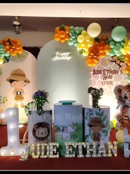 Jude Ethan's "Wild One" party featured a lineup of adorable safari animals against a clean, modern backdrop. I used marquee lights for the number "1" and the name, adding a warm glow to the entire jungle-themed display.