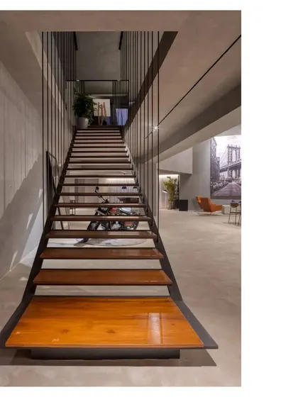 An elemental gallery and party space, finished in seamless gray concrete. The architecture takes a relaxed approach, allowing atmosphere and people to make the space, which can transform for exhibits, music, and get togethers of every kind.
