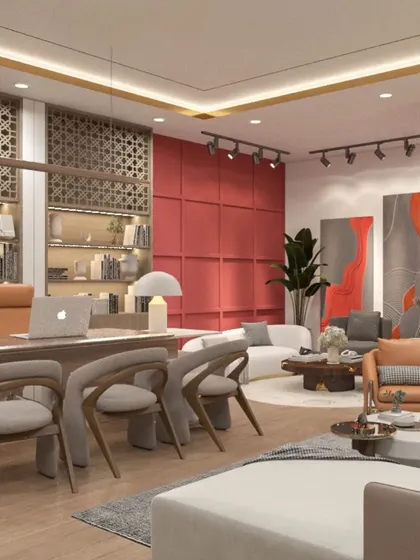 A wide-angle view of an executive office, highlighting the use of a bold red accent wall and contemporary art to create a dynamic and inspiring atmosphere.
