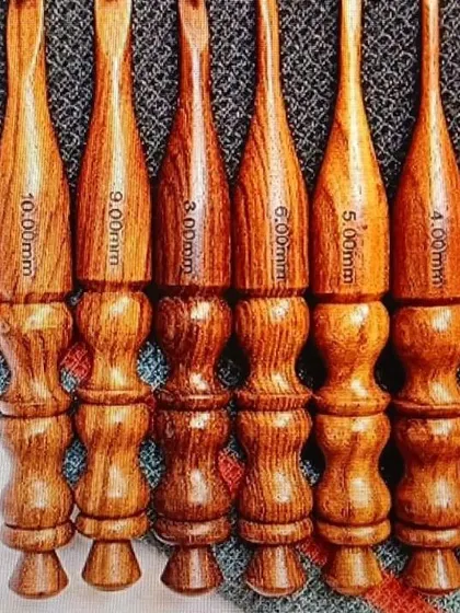 I offer a range of classic, fully wooden crochet hooks. They are polished for a smooth glide and carved to fit comfortably in your hand, with the size clearly marked on each one.