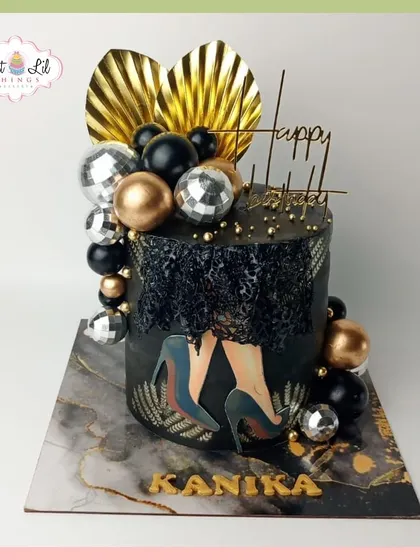 Stepping into elegance with this glamorous black and gold birthday cake for Kanika. The design features a disco ball, high heels, and a sophisticated marble-effect board.