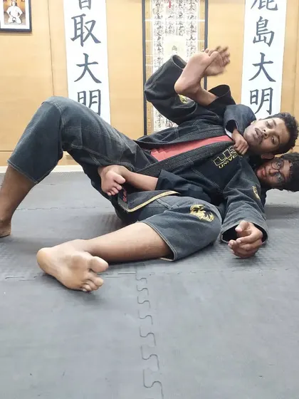 Teaching the next generation of grapplers at The Dojo. Here, I'm demonstrating a BJJ technique to my young students.