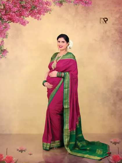 A vision in pink and green. This beautiful silk saree is complemented by a floral backdrop, blending traditional elegance with a touch of nature.