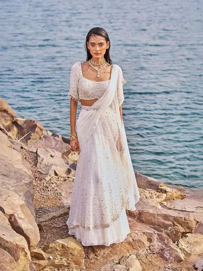 A stunning ivory sharara-saree, a perfect blend of traditional and contemporary styles for the modern woman.