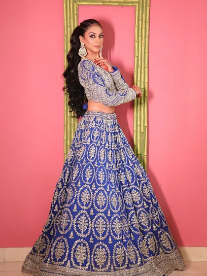 A full-length view of the royal blue lehenga, a classic and regal choice.