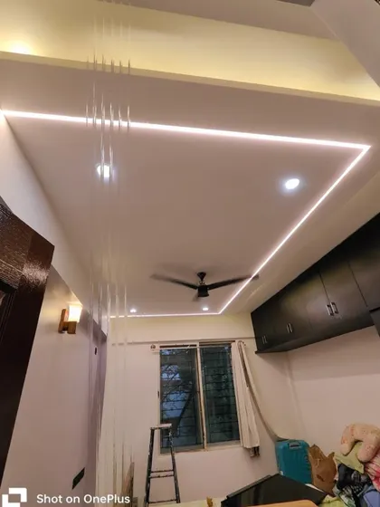 A freshly painted bedroom ceiling featuring modern cove lighting. We ensure that ceilings are painted perfectly smooth to enhance the effect of any lighting installations.
