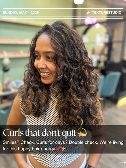 Curls that don't quit. This client is living for her happy hair energy after we refreshed her color and defined her beautiful curls.