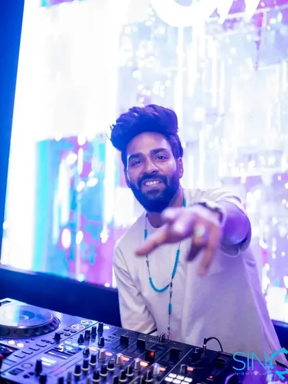 Interacting with the crowd at SinQ Nightclub. A great set is a conversation, and my job is to keep the energy flowing back and forth between the booth and the dance floor.