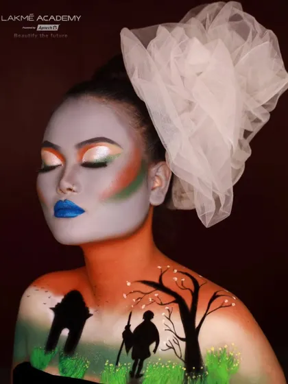 A side profile of the creative Independence Day makeup, showing the seamless blend of colors across the face and chest. Our courses teach students how to use the human body as a canvas.