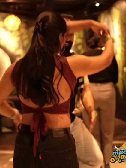 A beautiful turn captured from behind. Social dancing is all about movement and connection, and our photographers are experts at catching these fluid moments.