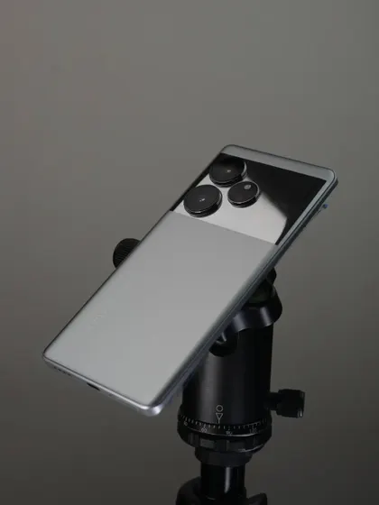 The realme GT6 mounted on a tripod, showing the basic setup used to get a stable, clean shot for commercial work.