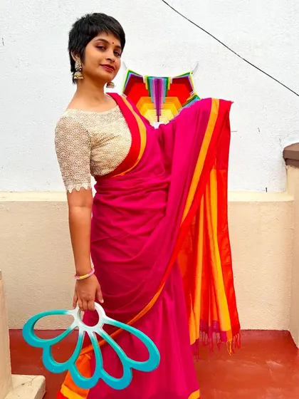 Blending the elegance of a saree with the movement of my fans feels so natural. It shows that flow is a part of who I am. This art isn't separate from life; it weaves into it, adding color and grace to the everyday.