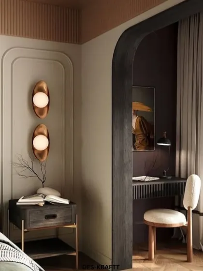 This view reveals a cozy study nook carved out by a dark, arched entryway, complete with a minimalist desk and chair, perfect for quiet focus.