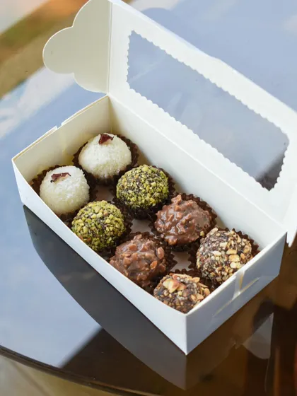 An assorted box of our Diwali truffles, with flavours like pistachio, coconut, and roasted almond.