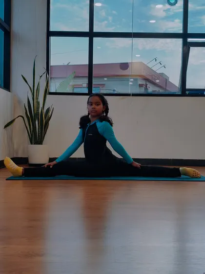 A full front split, or Hanumanasana, performed with ease by Charvi. Her journey shows what is possible with consistent practice and a love for yoga.