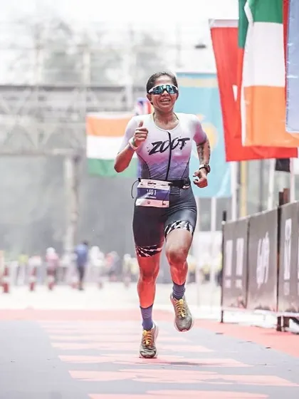 The final strides towards the Ironman Goa finish line. The flags of the world in the background are a reminder of the global community I'm a part of.