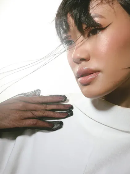 Lined with precision, defined with style. A final shot from this creative series, showcasing the sharp winged liner and unconventional lash work.