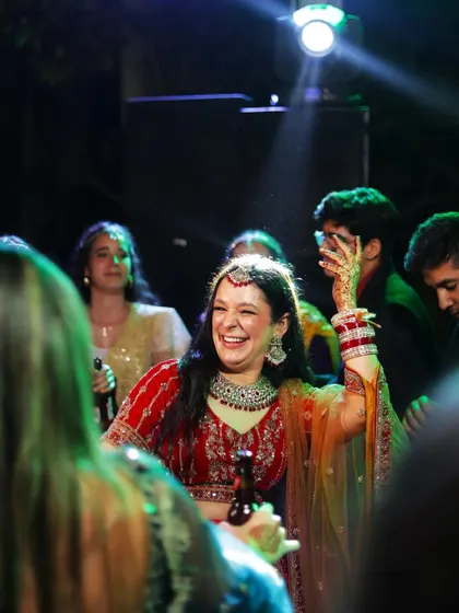 A bride enjoying the celebration, her smile lighting up the dance floor. I look for these moments where the bride is simply having the time of her life.