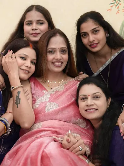 My academy is more than just a classroom; it's a family. This is one of my favorite pictures, a moment of pure joy and connection with my students on their graduation day.
