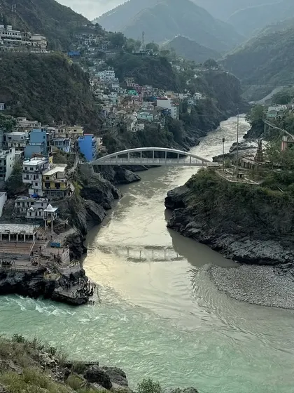 The sacred confluence at Devprayag. This is where the Alaknanda and Bhagirathi rivers meet to form the holy Ganga, a significant and beautiful stop on our spiritual journeys.