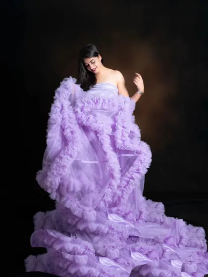 The layers of this lavender ruffle gown create beautiful texture and volume.